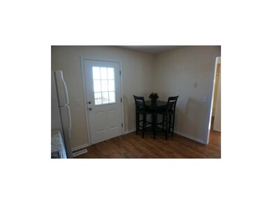 new wood floors, door leads to deck