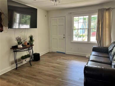 Entryway featuring wood finished floors and baseboards
