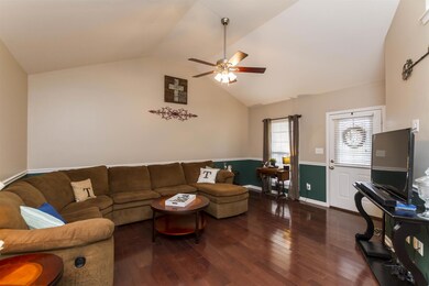 Welcoming Entry to the Spacious living area with a Hunter Ceiling Fan