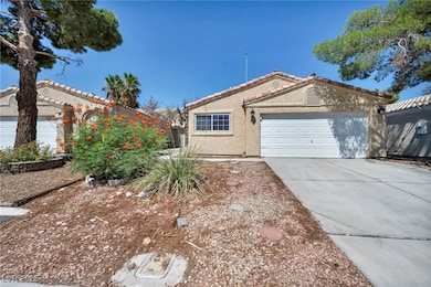 Ranch-style home with stucco siding, driveway, a t