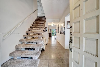 Upon entering, the staircase is to the right. Main living area straight ahead.