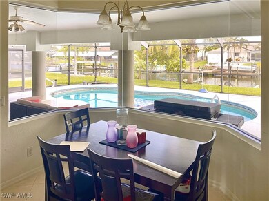 Dining space featuring a water view, tile patterned floors, and a wealth of natural light