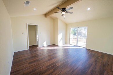 Spare room featuring dark hardwood / wood-style fl