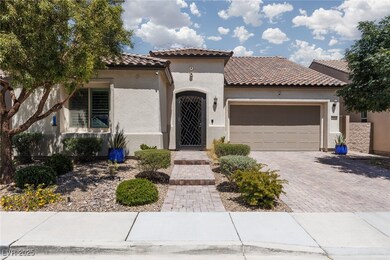 Mediterranean / spanish-style house featuring a ti