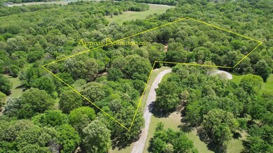 Bird's eye view featuring a wooded view