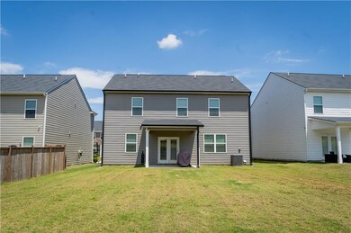 Back of property featuring french doors