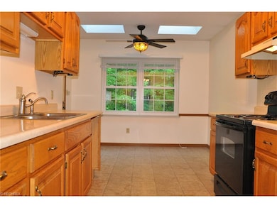 Eat-in Kitchen featuring a new ceiling fan. Stove 