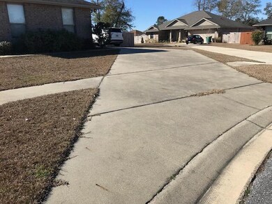 Long driveway leads to 2 car garage