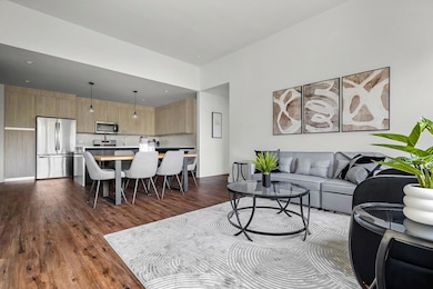 Living area with dark wood-style flooring