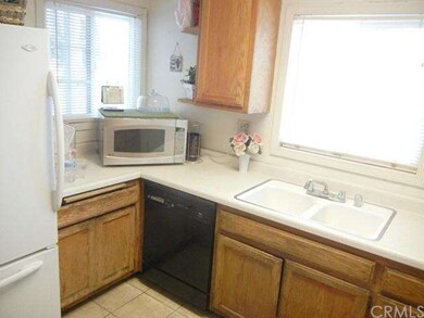 Kitchen is bright and sunny...a pleasant place to 