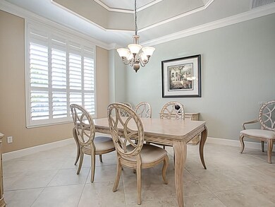 Formal dining room with TRAY ceiling opens to the 