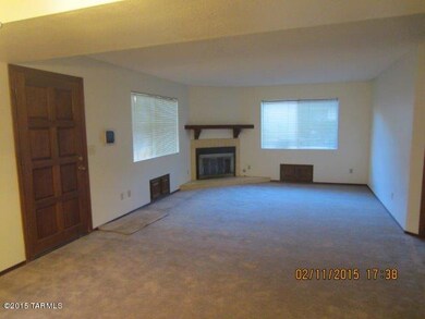 great room with fireplace and new carpet