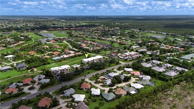 View of property location with a nearby body of water and nearby suburban area