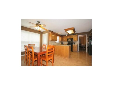 Efficient U-shaped kitchen with abundant granite c