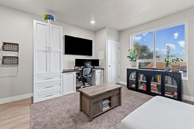 Office with recessed lighting and a textured ceiling