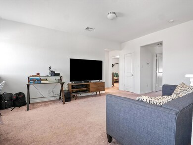 Living area featuring light carpet