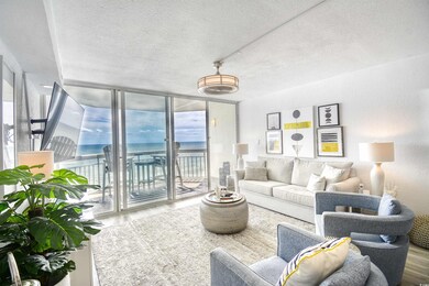 Living room featuring a textured ceiling, floor to