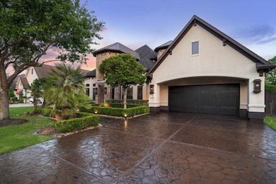The residence boasts a blend of stone and stucco f