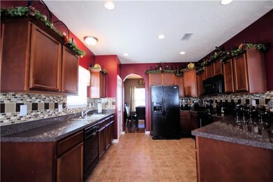 THIS KITCHEN FEATURES LOTS OF CABINET AND COUNTER SPACE AND PANTRY. REFRIGERATOR STAYS!