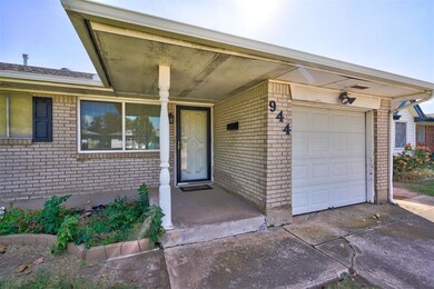 View of exterior entry featuring a garage