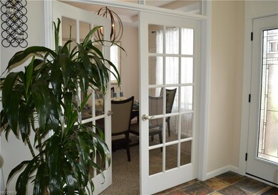 French doors to dining room just off the foyer.