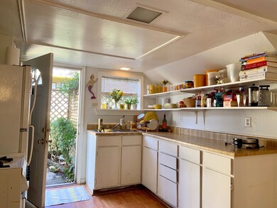 Kitchen includes refrigerator and oven.