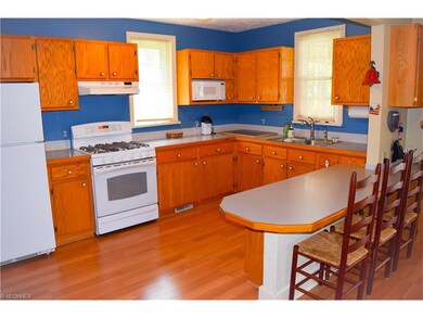 KITCHEN VIEW 2. BREAKFAST BAR, NEUTRAL COUNTERTOPS