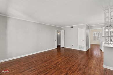 Unfurnished living room with dark hardwood / wood-