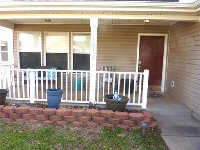 Doorway to property featuring a porch