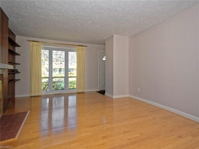 Family room's floor-to-ceiling front windows  Wall