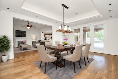 Experience open-concept living at
its finest in this spacious dining
area adjacent to the gourmet
kitchen. The sophisticated
chandelier and large tile flooring
enhance the room's modern
appeal, making it ideal for both
casual family meals and formal
dining.