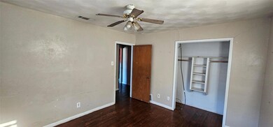 Unfurnished bedroom featuring ceiling fan, a close