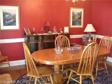 Dining Room. The hardwood flooring, chair rail sets this dining room apart. Lots of room for Thanksgiving dinners.