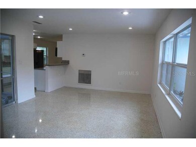 Living Room - Sparkling terrazzo floors polished back to new, then freshly sealed and waterproofed  Additional eating bar facing kitchen.