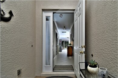 Front entry looking into the hallway to the screened lanai and pool