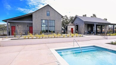 Community pool with a patio and fence private yard
