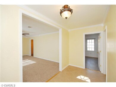 Foyer - Large foyer with ceramic tile floor has en