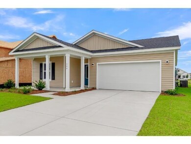 View of front of property with covered porch, a ga