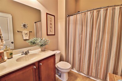 Features a tub/shower combo, linen closet and vani