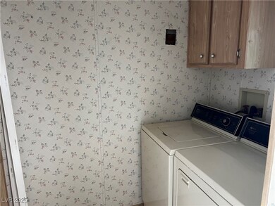 Laundry room featuring cabinet space, independent