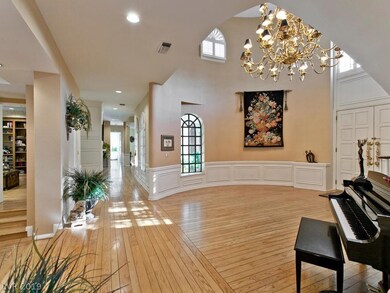Entry looking towards formal dining room , powder