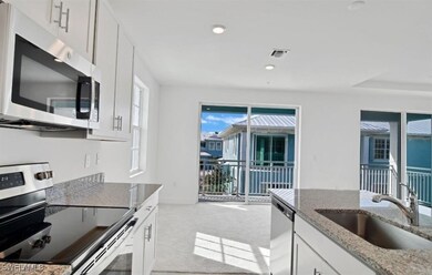 Kitchen featuring appliances with stainless steel