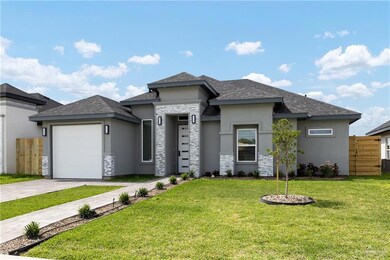 Prairie-style home featuring stucco siding, roof with shingles, a front yard, an attached garage, and driveway