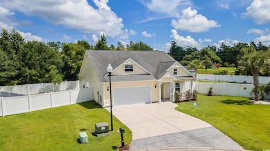 Craftsman house with concrete driveway, a garage, roof with shingles, and a fenced backyard