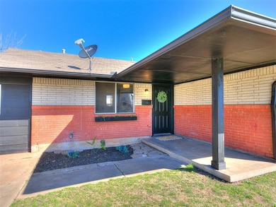 View of exterior entry with brick siding