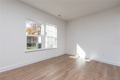 Empty room featuring light wood-type flooring
