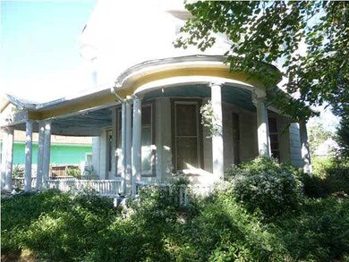 Wonderful wrap-around porch with turret.