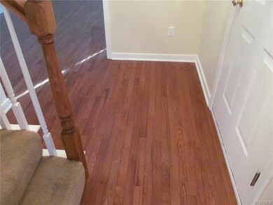 Entrance area showing hardwood floors