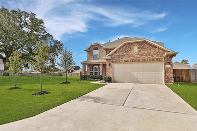 Featuring an attached two-car garage, with coach lights, and full brick front.