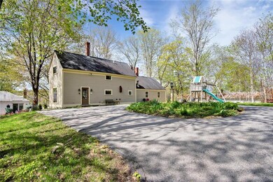 Back view. Circular driveway for...